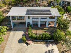  12 Tasman Court Boyne Island QLD 4680 $475,000 Welcome to 12 Tasman Court, Boyne Island! This stunning 4-bedroom, 2-bathroom house is the perfect family home. With a spacious land area of 925 sqm, there is plenty of room for everyone to enjoy. Step inside and be greeted by the modern and stylish interior. The property downstairs features tiled living with air conditioning, bar area, bathroom, shower, vanity, laundry and separate toilet, perfect for a games room. The 4th bedroom has air conditioning and carpet, pull down blinds and security screens. Internal stairs to the upstairs level you walk into the open plan living, kitchen, dining area which is so spacious and be updated throughout with the beautiful timber look lino flooring, air conditioning and a ceiling fan. Step out to the front timber verandah that is so private but also provides a light and breezy space to sit and enjoy your morning cuppa. You can enjoy the wonderful views looking over Boyne Island and small glimpses of Facing Island and the ocean. The kitchen has a 4 element gas stove, electric oven, exhaust fan, dishwasher, space for a good sized fridge, walk in pantry with plenty of space, lots of cupboard storage. As you walk down the hall way there's a linen closet, the main bathroom, a bath, shower, vanity and separate toilet. Then you will find the other 3 bedrooms with carpet flooring, built-in robes, ceiling fans, air conditioning, pull down blinds and security screens The exterior of the property is just as impressive. The fully fenced yard provides security and privacy, while the outdoor entertaining area is ideal for hosting friends and family with the outdoor pizza oven. The property boasts a 6.5kw solar system with 5kw battery, making it eco-friendly and cost-effective. There is a garden shed to the left hand side with side access meaning potential to park something small. Then there is a cement landing out the front for extra parking and a double bay covered carport. Situated in a sought-after location, this property offers the best of both worlds - a peaceful countryside feel while still being close to central location in Boyne Island. The surrounding nature and vegetation create a serene and tranquil atmosphere backing onto bushland behind. Don't miss out on the opportunity to own this beautiful property. The property is vacant and ready to move into so dont delay an inspection. With its spacious layout, modern features, and stunning location, this house is sure to impress.  