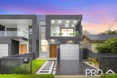  9 Harford Avenue East Hills NSW 2213 $1,739,000 Design, quality and high-end luxury - this stunning brand new architectural executive residence will absolutely impress while exclusively positioned in a boutique, leafy enclave. This high-spec sensation showcases contemporary style and features an impressive two-level floorplan highlighted by cutting-edge appointments, many creative design pieces and an easy-to-maintain level block of land. From conception to completion, this spectacular duplex has been meticulously executed to create the ultimate family escape. It is one of the finest properties to come onto the local market and promises to provide style, inspiration and an ultra-private entertainment environment that's within easy access to local schools, parks, Panania shopping village and fast train to the city and airport. - Brand new 2024 designer duplex on 378sqm of land (approx) - Breathtaking entry foyer with soaring 5 metre ceilings - 4 to 5 spacious bedrooms all with built-in robes, 2 with adjoining ensuites - Dedicated home office area overlooking the kitchen and living areas - Extensive, walk in butler's pantry with ample storage, bench space & side access - Beautiful open plan living with soaring 5 metre ceilings plus integrated fireplace - Sliding doors flowing out to the expansive outdoor entertaining area - Level back yard with built-in bbq facilities, perfect for the whole family - Ducted air conditioning throughout for year round comfort - Bonus 'Out-Building' with all necessary facilities for the extended family - Also ideal to run a small business from home - hairdresser, accountant etc - 8 minute walk to Panania Fast Train to the city & airport - Easy stroll to schools, parks + local shopping facilities - Potential rental return $1,500 to $1,700 per week 