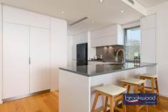  Unit 5/5 Reserve St Scarborough WA 6019 $825,000 Steps from the iconic Scarborough beach, this luxury second-floor apartment gazes out to the Indian Ocean, a symphony of changing colours and moods. High-spec finishes, including oak floors and Miele appliances, an open plan design that melds into a wide balcony overlooking the sea and a small complex with a communal pool, gym and sauna come together to deliver boutique living steps from the rejuvenated promenade and 15 kilometres from Perth CBD. 2 bedrooms 2 bathrooms 2nd-floor corner apartment Huge balcony ocean views Oak floors Miele appliances Pool gym and sauna onsite High ceilings double glazing Secure complex UC parking 2 bays Intercom system & CCTV security Oceanside boutique complex Winner 2015 MBA Award – Best built apartment building in WA Steps from the azure waters of Scarborough Beach and the vibrant array of restaurants, bars, and entertainment along the revitalised promenade, this sophisticated oceanside apartment epitomizes the quintessential indoor-outdoor lifestyle. Its open-plan living seamlessly extends to a spacious balcony, offering panoramic vistas of the Indian Ocean. Positioned on the second floor and occupying a coveted corner spot, the apartment employs lofty ceilings, expansive full-height windows, and a predominantly white palette to craft a refined living experience within a secure boutique complex. Oak flooring, sumptuous carpets and gleaming white stone surfaces accentuate the spectacular light of the coastal setting. The thoughtfully designed, impeccably appointed kitchen delivers ample inspiration for at-home, oceanside dining and entertaining with an electric oven, induction cooktop, dishwasher, ample storage and a sleek stone countertop. Tucked discreetly to the rear of the kitchen, a stylish European laundry adds to the convenience of modern living. Both bedrooms boast fitted built-in robes and soft carpet underfoot. The main bedroom boasts a fitted walk-in robe and modern ensuite with shower vanity and WC. The second bedroom has a built-in robe and accesses the family bathroom, a well-appointed space with shower, vanity and WC. Double glazing, ducted reverse cycle air conditioning, fobbed access, intercom and CCTV ensure exceptional comfort and convenience. Undercover parking for two cars, a storage unit, an on-site sauna, gym and pool add to this apartment’s long list of amenities and deliver the ultimate oceanside home. 