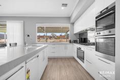  22 Moort Rise Carramar WA 6031 $1,150,000 WOW! This stunning 5-bedroom, 3-bathroom property can only be described as HUGE! Situated in the sought after ‘Wildwood Estate’ Carramar on a premium 1,539sqm block, this residence offers the space & quality that your family deserves. Features & benefits include: * Exposed aggregate driveway * Wide front verandah leading to double door entrance * Grand entry foyer with feature recessed ceiling * Huge master bedroom suite with French doors to outside, walk through fully fitted dressing room leading to deluxe ensuite with twin vanities, walk in shower, freestanding bath, floor to ceiling tiling & separate WC * Home theatre with double doors * Guest bedroom suite with ensuite * 3 further spacious bedrooms * Home office * Activity area * Open plan family & meals areas with electric effect fire * Stunning kitchen with engineered stone benchtops incorporating recessed sink, 3 ovens, dishwasher, 900mm gas cooktop, walk in pantry, double fridge recess * Scullery with stone benchtops, sink & further cabinets leading through to fitted laundry * Family bathroom with twin vanities, shower & bath * Powder room * Reverse cycle my zone air conditioning for year-round comfort * Vinyl plank flooring * Outdoor entertainment areas with polished concrete flooring * Extensive synthetic lawn for minimal maintenance * Children’s playground with inground trampoline * Full side drive though access providing plenty of parking for boat / caravan / cars & trailers * Double, remote garage * Built by Dale Alcock Homes * 392 sqm Under Main Roof * 332 sqm internal floor space excluding garage * Huge 1,539 m2 block 