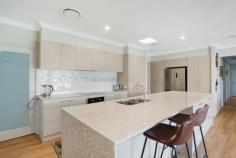  10 Cooly Ave Kitchener NSW 2325 $1,190,000 – This beautiful ‘like new’ four bedroom family home offers the opportunity to enter one of the most sought after estates in the local area! – Set on a 2087m2 block and only 5 minutes from town conveniences, this sensational property is waiting for you to call it home! – Allworth constructed four bedroom home in immaculate condition. There is simply nothing to be done! – The master suite is to one end of the house and offers a large walk in robe and beautiful ensuite – All three other bedrooms offer wardrobes with two even having their own walk in robes – The modern kitchen is the hub of the home with glass cooktop, dishwasher and huge walk-in pantry. The large island stone bench has additional drawer storage and a stunning undermounted sink. – The kitchen is open plan to the main living and dining area which flows through to the alfresco entertaining space – Media room to the front of the home provides the additional living space that could also double as the office – The family bathroom is large and the positioning of the bath at the end of the room allows you to soak and take in the views of the garden! – Laundry is very conveniently positioned with built in storage, additional toilet and external access – Live comfortably all year round with ducted air conditioning throughout – Loads of room for the tools and toys with an attached double garage that has plenty of storage options with shelving, provisions for storage in the ceiling and even the added extra of insulation on the garage door to keep the temperature to a minimum – Solar panels installed to keep expenses to a minimum and there are also 2x 5000L water tanks which allow plenty of water to keep the lawns and gardens looking fresh all year round – The large block with fantastic access down the side allows the opportunity to build the large garage of your dreams – Established gardens and a fully fenced block frame what is a package not to be missed! 