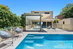  5A Fortescue St Chiswick NSW 2046 Revealing a captivating views out to Abbotsford Bay, Parramatta River and beyond, this north-facing residence balances architectural luxury with low-maintenance living. The home offers the complete lifestyle package, in a prestigious idyllic waterside address. Framed in walls of glass to welcome an ever-changing view, it's elegant interiors lengthen out to a poolside terrace with a kitchen, ideal for private entertaining. The four bedroom family home offers state-of-the-art design with impeccable style, quality and sophistication in a highly sought-after location. 650m to Chiswick Wharf, 500m to Chiswick Village and 450m to Campbell Park. • Combined living/dining space in addition to a sunken lounge • Dual outdoor flow promotes seamless cross-flow ventilation • Mosaic-tiled heated swimming pool and poolside bathroom • Stone kitchen with waterfall edges, stainless steel Miele gas cooking • Travertine tiled outdoor living and entertainers terrace • Four bedrooms with built-ins, master with his/her walk-in robes and balcony • Master includes a private balcony and ensuite, tiles bathrooms • Ducted air-conditioning, downlights, three-step cornices and timber floors • Double lock-up garage has ample storage and internal access 