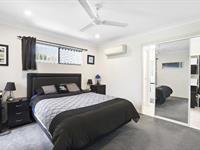  20 Bachelor Court MARIAN QLD 4753 Introducing a dream family home that offers the perfect blend of spacious living, modern elegance, and practical functionality. This immaculate four-bedroom residence is designed with the modern family in mind, offering a wealth of indoor and outdoor living spaces, providing the ultimate retreat for relaxation and entertainment. Upon entering this welcoming abode, you'll be greeted by a wide hallway that leads to an open-plan kitchen, dining, and living area, perfect for family gatherings or quiet evenings in. The main bedroom is a sanctuary of style and comfort, featuring a large walk-in robe and ensuite with a private toilet. The remaining three queen-sized bedrooms, all complete with built-in wardrobes, are carpeted throughout and all air-conditioned for comfort. At the heart of the home, you'll find a contemporary kitchen equipped with stainless steel appliances, including a dishwasher, ample cupboard and bench space, and a walk-in pantry. The generous family living area seamlessly flows onto a covered outdoor patio through sliding doors, making entertaining a breeze. For movie nights, retreat to the separate media room or a perfect private retreat for the kids. The family bathroom offers a touch of luxury with a separate shower and bath - perfect for unwinding. A separate powder room and large laundry with a third toilet ensure ample storage and practicality throughout the home. The outside is just as impressive, with a fenced 1011sqm yard boasting a high-rise 7 x 12m Shed with a hoist and 15amp power, plus an additional 6x6m Shed for extra storage. The expansive backyard is completed by a stunning pool, perfect for enjoying those long summer days. Nestled in the heart of Marian, this remarkable property is just minutes from the Marian Town Centre and a short 20-minute drive from Mackay. With an array of amenities close by, including schools and shopping precincts, and proximity to mining hubs, this small-town community offers the best of both worlds. 