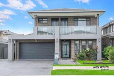  3 BARKLEY Street Marsden Park NSW 2765 Near New Architecturally Designed this spacious double-storey home is an entertainer's dream. sitting on a high side of the street designed with sleek contemporary aesthetics which is ultra-modern in concept and warmly inviting. * Spacious wide entry foyer via large doors. * Massive light filled open plan dining & living zone. * Additional living space. * Sleek & stylish kitchen features large island bench with 60mm Caesarstone tops and waterfall edging, quality stainless steel appliances, gas cooking, dishwasher and built-in microwave oven. * Generous study / home office. * Huge master suite comprises of large walk-in robe and palatial ensuite with freestanding bathtub and vanity . *Modern Balcony with view. * Second luxurious master suite boasts walk in robe and a plush ensuite * Modern family bathroom with freestanding bathtub with toilet. * Automatic double lock up garage with internal access, and Fully tiled. * 4 indulgent bedrooms with walk-in robes, two ensuites. * 3 ultra modern bathroom with stone-top vanity, bath and shower. * multi-zone ducted air-conditioning ensure this home sets a benchmark for comfort, style and conscience. * Down-lights throughout the home. * Huge, secure back yard. * outdoor gas cooking with Alfresco area. * Solar Panels. Short Drive to Business Park - Costco, Ikea, Bunnings Walking Distance to Lake , playing fields & Coles shopping centre, and Northbourne public school. 