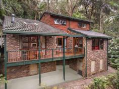  100 Otford Road Otford NSW 2508 The small village of Otford boasts a close community and proximity to Sydney with an abundance of trees and the sea at your doorstep. Nestled on the hillside of Otford on a private driveway, this unassuming four-bedroom brick and timber family home is perfectly suited to those who are looking for a lifestyle change amongst the trees while not compromising on location or space. YOUR HOME • The private driveway leads to this generous home combined with a leafy outlook and surroundings. Relax and enjoy the sunlight streaming through the trees while listening to the chorus of nature and all it has to offer. • This versatile floorplan is ideal for families and couples alike with plenty of space and work from home options galore. • The lower level of this split-level residence is a treehouse-inspired living quarter with easy access to a spacious deck. It includes a formal living room, a generously sized dining area, a family room, and a spacious kitchen equipped with ample bench and cupboard space - perfect for passionate cooks, large families, or festive gatherings. • Moving up to the second level, you'll find the parents' retreat featuring a roomy master bedroom with an ensuite, a bathroom boasting a spa bath, and another generously sized bedroom. • The third level boasts two double bedrooms adorned with built-in robes, ceiling fans, and windows that unveil breathtaking bush vistas. • Storage is plentiful in this property, offering an oversized linen cupboard, beneath-the-floor storage, a spacious storage area under the house with impressive head height, a large single garage with additional storage, and a garden shed. • The residence is characterized by meticulous details, including brick & timber clad construction, timber floorboards throughout, timber window frames, raked ceilings, and rustic exposed beams. • A slow combustion fireplace, two split system air conditioning units and ducted HVAC air filtration system. • Endless opportunities on this large 1,267 sq/m block with generous backyard of natural bushland including approximately 4 metres of frontage on the Hacking River. YOUR LIFESTYLE • The train station is 850 metres from your front door making your commute easy and convenient. The historical village of Helensburgh is a 2.9 km offering all shopping conveniences, cafes, restaurants, clubs, and medical services. Helensburgh also caters for a broad range of sporting activities including a newly constructed mountain bike trail course. • Highly regarded and community focused Otford Primary School is literally a few minutes stroll from your front door. • 4.3 km South is the pristine Stanwell Park Beach or walk from your front door to Bulgo or Werrong beaches, Bald Hill or the Royal National Park. If you appreciate spending time with your family outdoors, this is the perfect location. • Embrace coastal living with swimming, surfing, fishing, bushwalking, hang gliding and picnics amongst natures best, all available only moments from your doorstep. • Otford offers a tranquil lifestyle, with easy access to Sydney, (1 hour to Central, 25 minutes to Wollongong) and all that this gorgeous coastline has to offer. 