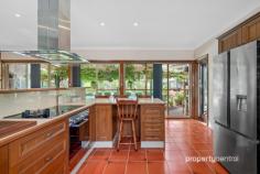  75 Ridgehaven Rd Silverdale NSW 2752 $1,850,000 - $1,900,000 Nestled on the picturesque 1-acre expanse at 75 Ridgehaven Rd, Silverdale, this custom master-built brick veneer residence boasts an array of exceptional features, embodying meticulous craftsmanship and thoughtful design. The property is graced with a brick front fence, a remote-controlled sliding vehicle access gate, and a separate pedestrian gate for added security and convenience. A fully landscaped pebble-create driveway, sandstone steps, and retaining walls lead to the meticulously maintained house surrounded by established gardens, complete with an inviting garden arbour with seating. The residence itself features three double-bed-sized rooms, each equipped with large mirrored robes, and a versatile fourth room suitable as a bedroom or home office/study. The spacious master bedroom includes an ensuite for added comfort. The kitchen is well-appointed with oak timber cupboards, a pantry, a ducted glass and stainless-steel range hood, and quality appliances set against terracotta floor tiles. The family room, seamlessly integrated with the kitchen, showcases a striking brick feature wall and shares the allure of terracotta floor tiles throughout. With cathedral solid cedar ceilings in the lounge and dining rooms reaching approximately 4.0m high, the house exudes a sense of grandeur. Noteworthy amenities include a fully ducted reverse cycle air conditioning unit, a large external laundry with built-in ironing centre, a generously shelved external walk-in store room, and a spa/bath in the main bathroom. The property’s exterior is equally impressive, featuring extensive solar pergolas, a full-sized entry, a double garage with a mechanics’ pit, a double carport with three-phase power, a saltwater swimming pool, an all-weather BBQ area, and raised vegetable garden beds. Furthermore, the house is pre-wired for security alarms, and the garage boasts remote-controlled roller doors. With additional features such as extra-wide eaves to facilitate passive solar benefits and proximity to school bus routes for Penrith and Camden-Narellan-Elderslie, this property offers a lifestyle of unparalleled comfort and convenience. Contact Leonidas today to book in a private viewing! * Custom Master-built Brick Veneer Home on 1 Acre * Outdoor Oasis: Solar Pergola, Saltwater Pool, and All-Weather BBQ Area * Spacious Interior with 3 Double Bedrooms, Master Ensuite, and Versatile Fourth Room * Exceptional Extras: Fully Ducted Air Conditioning, Mechanic’s Pit, and Remote-Controlled Garage Doors 