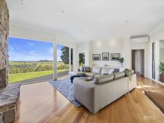  75 Arnolds Road Koonwarra VIC 3954 $1,850,000 - $1,920,000 Prepare to fall in love as you meander the curved tree-lined driveway, to discover this contemporary Victorian-style country home. Built in 2009, this quality architecturally designed home, is situated on approximately 3acres, overlooking much larger rural properties, with uninterrupted panoramic views across the Tarwin Valley, as far as Wilsons Promontory. At the end of a country lane, it is secluded, private and quiet, with abundant bird and native wildlife creating the only "noise". The family, dining & kitchen are the heart of the home. Spacious, flooded in natural light, with Tasmanian Oak timber floors, and the centerpiece Cheminées Philippe double sided wood fire set in Mount Angus Sandstone. Comprising of a country style kitchen with beautiful blackwood bench tops, quality appliances, and walk in pantry, an expansive dining space with 4m pitched roof and soaring glass picture windows, and comforting family lounge. The east wing, wrapped by the charming veranda, includes a classically styled formal lounge, and across the wide hallway you will find the master suite with spacious walk-in robe, ensuite complete with deep bath set in bay window, walk in shower, and separate toilet. The additional three queen size bedrooms are located in the west wing, each with generous built in robes, desks and spectacular views, with their own rumpus/ third living room, which has direct access to a north facing deck and is bathed in natural light. The family sized bathroom, separate powder room, & enormous laundry with direct under cover access to garage are also in this wing. Storage throughout the house is plentiful, including a custom storeroom. Established trees throughout a low maintenance garden including vegetable garden with raised beds, numerous productive apple, and citrus trees. and the tree lined driveway with ornamental Manchurian Pears providing 4 seasons of spectacular displays. Quality boundary and internal electric fencing, currently divided into 3 paddocks, which has until recently, serviced a horse and 2 companion sheep. Ideally suited to small flock of sheep and/or a horse or two. Separate 5 bay shed (18m x 7.5m) ideal storage for all your toys, boat, caravan, or horse float. 90,000L water tank storage providing ample water for the residence & property. 1500metres to the Great Southern Gippsland Rail Trail, 6mins to Meeniyan, 10mins to Leongatha, 20mins to Inverloch, and an easy 90min to SE suburbs of Melbourne. This exceptional country home is a rare gem in a magnificent location. If you have been searching for a modern, stylish country residence, then this is most worthy of your consideration. 