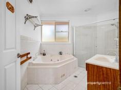  75 Ridgehaven Rd Silverdale NSW 2752 $1,850,000 - $1,900,000 Nestled on the picturesque 1-acre expanse at 75 Ridgehaven Rd, Silverdale, this custom master-built brick veneer residence boasts an array of exceptional features, embodying meticulous craftsmanship and thoughtful design. The property is graced with a brick front fence, a remote-controlled sliding vehicle access gate, and a separate pedestrian gate for added security and convenience. A fully landscaped pebble-create driveway, sandstone steps, and retaining walls lead to the meticulously maintained house surrounded by established gardens, complete with an inviting garden arbour with seating. The residence itself features three double-bed-sized rooms, each equipped with large mirrored robes, and a versatile fourth room suitable as a bedroom or home office/study. The spacious master bedroom includes an ensuite for added comfort. The kitchen is well-appointed with oak timber cupboards, a pantry, a ducted glass and stainless-steel range hood, and quality appliances set against terracotta floor tiles. The family room, seamlessly integrated with the kitchen, showcases a striking brick feature wall and shares the allure of terracotta floor tiles throughout. With cathedral solid cedar ceilings in the lounge and dining rooms reaching approximately 4.0m high, the house exudes a sense of grandeur. Noteworthy amenities include a fully ducted reverse cycle air conditioning unit, a large external laundry with built-in ironing centre, a generously shelved external walk-in store room, and a spa/bath in the main bathroom. The property’s exterior is equally impressive, featuring extensive solar pergolas, a full-sized entry, a double garage with a mechanics’ pit, a double carport with three-phase power, a saltwater swimming pool, an all-weather BBQ area, and raised vegetable garden beds. Furthermore, the house is pre-wired for security alarms, and the garage boasts remote-controlled roller doors. With additional features such as extra-wide eaves to facilitate passive solar benefits and proximity to school bus routes for Penrith and Camden-Narellan-Elderslie, this property offers a lifestyle of unparalleled comfort and convenience. Contact Leonidas today to book in a private viewing! * Custom Master-built Brick Veneer Home on 1 Acre * Outdoor Oasis: Solar Pergola, Saltwater Pool, and All-Weather BBQ Area * Spacious Interior with 3 Double Bedrooms, Master Ensuite, and Versatile Fourth Room * Exceptional Extras: Fully Ducted Air Conditioning, Mechanic’s Pit, and Remote-Controlled Garage Doors 