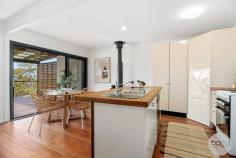  13 Irambang Street Nelson Bay NSW 2315 In a popular pocket of Nelson Bay and only 300m from the beach you will find 13 Irambang Street, Nelson Bay - the ideal weekender, holiday property, permanent residence or a future redevelopment site that offers a brilliant and laidback, coastal lifestyle. This freestanding home is elevated with a leafy outlook as well as offering water views across the bay. The large and fully covered entertaining balcony is the perfect space to relax and soak in the stunning vista on offer here. Hosting one oversized bedroom of accommodation with a modern bathroom, this home has been perfectly refurbished and is ready to enjoy immediately whilst also offering plenty of scope for future works to extend. This fantastic location will impress positioned in a quiet street but still being so close to both Bagnall Beach and Dutchies Beach as well as a short walk into Nelson Bay where you will find all the local amenities you need including restaurants, shops, cafes and more! 