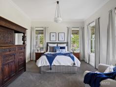  75 Arnolds Road Koonwarra VIC 3954 $1,850,000 - $1,920,000 Prepare to fall in love as you meander the curved tree-lined driveway, to discover this contemporary Victorian-style country home. Built in 2009, this quality architecturally designed home, is situated on approximately 3acres, overlooking much larger rural properties, with uninterrupted panoramic views across the Tarwin Valley, as far as Wilsons Promontory. At the end of a country lane, it is secluded, private and quiet, with abundant bird and native wildlife creating the only "noise". The family, dining & kitchen are the heart of the home. Spacious, flooded in natural light, with Tasmanian Oak timber floors, and the centerpiece Cheminées Philippe double sided wood fire set in Mount Angus Sandstone. Comprising of a country style kitchen with beautiful blackwood bench tops, quality appliances, and walk in pantry, an expansive dining space with 4m pitched roof and soaring glass picture windows, and comforting family lounge. The east wing, wrapped by the charming veranda, includes a classically styled formal lounge, and across the wide hallway you will find the master suite with spacious walk-in robe, ensuite complete with deep bath set in bay window, walk in shower, and separate toilet. The additional three queen size bedrooms are located in the west wing, each with generous built in robes, desks and spectacular views, with their own rumpus/ third living room, which has direct access to a north facing deck and is bathed in natural light. The family sized bathroom, separate powder room, & enormous laundry with direct under cover access to garage are also in this wing. Storage throughout the house is plentiful, including a custom storeroom. Established trees throughout a low maintenance garden including vegetable garden with raised beds, numerous productive apple, and citrus trees. and the tree lined driveway with ornamental Manchurian Pears providing 4 seasons of spectacular displays. Quality boundary and internal electric fencing, currently divided into 3 paddocks, which has until recently, serviced a horse and 2 companion sheep. Ideally suited to small flock of sheep and/or a horse or two. Separate 5 bay shed (18m x 7.5m) ideal storage for all your toys, boat, caravan, or horse float. 90,000L water tank storage providing ample water for the residence & property. 1500metres to the Great Southern Gippsland Rail Trail, 6mins to Meeniyan, 10mins to Leongatha, 20mins to Inverloch, and an easy 90min to SE suburbs of Melbourne. This exceptional country home is a rare gem in a magnificent location. If you have been searching for a modern, stylish country residence, then this is most worthy of your consideration. 