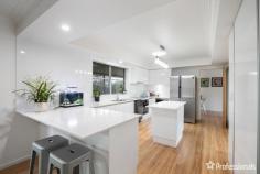  11 Chestnut Avenue Armidale NSW 2350 $800,000 - $880,000 Welcome to 11 Chestnut Avenue, a magnificent family residence nestled on the sought-after North Hill of Armidale. Boasting an expansive 1,081 square meters of land, this generously proportioned five-bedroom home offers an ideal blend of space, comfort, and modern living. As you step inside, you’ll discover a spacious interior featuring five well-appointed bedrooms and three bathrooms, ensuring ample accommodation for the entire family. The residence offers versatility with two distinct living areas, including a cozy carpeted media room for relaxed entertainment. The heart of the home lies in the open-plan kitchen, showcasing a stylish breakfast bar, island bench, and abundant cupboard space – perfect for culinary enthusiasts. Adorned with crisp white cabinetry, the kitchen seamlessly flows into an adjoining formal dining room with sliding doors that open to an outdoor veranda, creating a seamless indoor-outdoor living experience. Outdoor enthusiasts will be delighted by the extensive alfresco area, providing the ideal setting for summer dining and entertaining. The undercover veranda overlooks meticulously landscaped gardens and lawns, creating a private oasis for relaxation and enjoyment. Additional features elevate the property’s appeal, including a solar system for energy efficiency, a convenient double lock-up garage with internal access, and the comfort of plantation shutters and ceiling fans throughout. The bathrooms are enhanced with heated towel rails, adding a touch of luxury to everyday living. Situated in close proximity to local corner stores and both private and public schools, 11 Chestnut Avenue offers a lifestyle of convenience and comfort. Don’t miss the opportunity to make this exceptional property your family’s new home – where space, style, and thoughtful design converge to create a truly captivating living experience. 