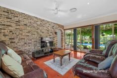  75 Ridgehaven Rd Silverdale NSW 2752 $1,850,000 - $1,900,000 Nestled on the picturesque 1-acre expanse at 75 Ridgehaven Rd, Silverdale, this custom master-built brick veneer residence boasts an array of exceptional features, embodying meticulous craftsmanship and thoughtful design. The property is graced with a brick front fence, a remote-controlled sliding vehicle access gate, and a separate pedestrian gate for added security and convenience. A fully landscaped pebble-create driveway, sandstone steps, and retaining walls lead to the meticulously maintained house surrounded by established gardens, complete with an inviting garden arbour with seating. The residence itself features three double-bed-sized rooms, each equipped with large mirrored robes, and a versatile fourth room suitable as a bedroom or home office/study. The spacious master bedroom includes an ensuite for added comfort. The kitchen is well-appointed with oak timber cupboards, a pantry, a ducted glass and stainless-steel range hood, and quality appliances set against terracotta floor tiles. The family room, seamlessly integrated with the kitchen, showcases a striking brick feature wall and shares the allure of terracotta floor tiles throughout. With cathedral solid cedar ceilings in the lounge and dining rooms reaching approximately 4.0m high, the house exudes a sense of grandeur. Noteworthy amenities include a fully ducted reverse cycle air conditioning unit, a large external laundry with built-in ironing centre, a generously shelved external walk-in store room, and a spa/bath in the main bathroom. The property’s exterior is equally impressive, featuring extensive solar pergolas, a full-sized entry, a double garage with a mechanics’ pit, a double carport with three-phase power, a saltwater swimming pool, an all-weather BBQ area, and raised vegetable garden beds. Furthermore, the house is pre-wired for security alarms, and the garage boasts remote-controlled roller doors. With additional features such as extra-wide eaves to facilitate passive solar benefits and proximity to school bus routes for Penrith and Camden-Narellan-Elderslie, this property offers a lifestyle of unparalleled comfort and convenience. Contact Leonidas today to book in a private viewing! * Custom Master-built Brick Veneer Home on 1 Acre * Outdoor Oasis: Solar Pergola, Saltwater Pool, and All-Weather BBQ Area * Spacious Interior with 3 Double Bedrooms, Master Ensuite, and Versatile Fourth Room * Exceptional Extras: Fully Ducted Air Conditioning, Mechanic’s Pit, and Remote-Controlled Garage Doors 