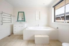  8 Drysdale Avenue Frankston VIC 3199 $760,000 - $836,000 A statement in space and seclusion, this four-bedroom two-bathroom home is a timeless expression of sun-drenched comfort with unwavering versatility. Set within the heart of Karingal, central to both John Paul College and Karingal Primary School, a convenient position amongst major shopping and recreational amenities, hospitals and parklands, while easy freeway access makes it ideal for those with a city commute. Designed to deliver a comprehensive entertaining lifestyle with two living zones, expansive outdoor dining space and a kitchen of modern practicalities, the home comforts families with gas ducted heating, reverse cycle heating and cooling and a gas fireplace in the front lounge. Stainless steel appliances and stone benchtops enhance the kitchen, where a servery window nurtures a connection with the outside as a decked alfresco and private garden setting complement a sensational summer lifestyle. Spilling across the dual-level design, the four bedroom accommodation offers restful retreat for families with a ground-floor master bedroom comprising generous walk-through robe and ensuite, an upstairs study and separate retreat, and a ground-floor bathroom with feature bath. Set only moments from Karingal Hub, Ballam Park, Monash University, Frankston Hospital and Bayside Shopping Centre. 