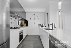  14 Rocklands Loop Carramar WA 6031 $500,000 This stunning 3-bedroom, 2-bathroom residence is guaranteed to impress! Offering a modern, bright & airy spacious layout with quality fixtures & fittings throughout; this property is ready to move straight into & enjoy! Features & benefits include: * Fully fenced front garden with synthetic lawn * Entrance hall * Home office / study * Master bedroom with twin walk in robes, reverse cycle split system air conditioning & ensuite with shower, vanity & separate WC * Open plan family & meals areas with reverse cycle split system air conditioning * Quality kitchen with fridge recess, mirrored splash backs, plenty of cupboard space, stone bench tops with waterfall edge & breakfast bar, pendant lighting, stainless-steel appliances including oven, cooktop & dishwasher * Linen closet * Shoppers’ access from the garage * 2 further spacious bedrooms with built in robes * Family bathroom with bath, shower & vanity * Well-appointed laundry with stone benchtops, mirrored splashbacks & overhead cupboards * 2nd WC * Outdoor, undercover entertaining area * Synthetic lawn areas * Double, remote garage * Low maintenance 368sqm bock * Close to schools, parks, shops, transport, The Duke Bar & Bistro, the Carramar Golf Course & all other local amenities 