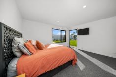  61 Bull Oak Way Grove TAS 7109 $1,400,000 Situated 30 minutes drive from Hobart's CBD at the entrance to the Huon Valley, this stunning four bedroom, two bathroom, two living room home offers a rural lifestyle within easy access of the city. Situated on 1.1 hectares (2.77 acres) of land, the 2022 built home has stunning views across the fertile valley to the dramatic western peaks of the Kunanyi/Mt Wellington range and iconic 'Sleeping Beauty'. The location and size of the block and the orientation of the house combine to maximise not only the views and sunshine throughout the day, but also the property's appeal. A white gravel driveway opens to the main entrance to the house, where a wide covered porch shelters double front doors. The architect's design is evident reflecting the stunning environment, with cathedral ceilings, hydronic heated polished concrete floors, floor-to-ceiling windows and exterior timber feature walls. The simplicity of the floor plan creates two separate bedroom wings on either side of the extensive kitchen/dining/living area. The primary bedroom has a large walk-in-robe plus luxurious ensuite with dual showers, while the other three double bedrooms have built-in-robes and access to a family bathroom with bath and shower, plus a separate toilet. The striking feature of this house is the living area with its cathedral ceiling creating a sense of space and light and having views to the mountains from every vantage point. Double sliding doors open to the patio on the northern side of the building, an ideal alfresco area, especially for evening drinks and barbecues as the sun sets over the Huon Valley. A second living room is accessed from the main living area and is a perfect TV room, play room, or quiet space for relaxation. A council approved 96m double garage and self-contained studio with bathroom has been designed to be located on the south-western side of the gravel driveway. There are 2 x 24,000L water tanks on the property, allowing you to forget about high water bills. The property is fully fenced with an electric gate and wallaby proof, to keep out the local wildlife and keep in your pets and children. The regional centre of Huonville is only 10 minutes' drive away providing a range of services from medical, to banking and other commercial facilities including a variety of shops and cafes, plus local primary and high schools. The Huon Valley is increasing in popularity as boutique industries develop throughout, including in the nearby townships of Cygnet and Franklin: an ideal location for a change of lifestyle. 