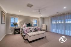  25 Kostic Blvd Narre Warren North VIC 3804 $2,350,000 - $2,450,000 Perfectly positioned on half-acre of beautifully landscaped gardens, this simply stunning Hamptons-inspired residence offers luxurious family living in an incredible location. Meticulously crafted by Porter Davis, spanning over 38 squares of living, this home blends sophistication with absolute comfort, promising an unparalleled lifestyle. Boasting 4 generously proportioned bedrooms, each accompanied by its own ensuite, including a lavish master suite featuring a private balcony, taking in stunning views of the surrounding landscape. A dedicated study situated at the front of the home provides a serene workspace or quiet retreat for remote professionals. Entertain in grand style with multiple living areas, including a formal lounge adorned with a gas log fire for cozy evenings. A relaxed family living zone, sunlit dining room, rumpus, and expansive upstairs retreat ensure ample space for every member of the family. Forming the centrepiece of the home, the beautifully appointed kitchen, is a culinary haven equipped with quality appliances, a separate walk-in pantry, and a butler's kitchen, ensuring functionality and elegance. Step outside to the decked alfresco area overlooking serene garden views, complete with a spectacular swimming pool, the perfect place to spend warm summer evenings with the family. Situated in a highly coveted pocket of Narre Warren North and surrounded by quality homes. Enjoy the peace and privacy of ‘semi-rural’ living while remaining close to all amenities, quality education, and convenient commuting options. Ready for endless enjoyment, this is your chance to secure the ultimate in upscale living! 