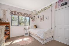  27 Durham Road Armidale NSW 2350 27 Durham Road Armidale is a stunning 5-bedroom, 3-bathroom home situated on a spacious 5 acre lot only minutes to town. This property is perfect for those looking for a peaceful and private retreat, while still being close to all the amenities Armidale has to offer. The house itself is architechturally designed, with a modern and stylish interior that is sure to impress. An open plan living & dining area features raked ceilings and angled windows & connects seamlessly to the modern country kitchen with beautiful stone benchtops, ceramic double sinks, 90 cm gas stove and electric oven and an island bench/breakfast bar. A bi-fold servery window makes entertaining a breeze allowing direct access to the timber deck. Enjoy views of the surrounding rural landscape and hills from the large windows and sliding doors, double glazed for comfort and backed up by a ducted gas heating system for the cooler months. The main bedroom in it's own wing of the home includes a walk-in robe, en-suite bathroom with separate toilet, and French doors leading to the verandah. A family room & study with separate heating and reverse cycle air -conditioning compliments the remaining four bedrooms, allowing a separate space for the family to enjoy separate pass times. The main bathroom is light and bright with a built in bathtub & shower, the three-way design with double vanity is convenient for the busy morning routine. Bamboo floors and high quality carpet grace the entire home, adding warmth and character. Not to be forgotten, solar hot water, Hebel and enviro wrap insulation, town water connection & 2 x rainwater tanks. A double lock up garage provides secure car accommodation and there is the addition of a separate single lock up shed with 2 open bays, perfect for those with hobbies or a need for extra storage or car accommodation. The established lawns and gardens are a feature of this magnificent property, with manicured hedges, your own orchard, chook run and ample space to create a sustainable living garden. The house yard features established tree's for privacy from neighbours & the rear of the block is separately fenced with a dam, perfect for the hobby farmer after space for a few sheep or a horse. This modern property exudes character and is a rare opportunity for those looking for a spacious and luxurious home in a beautiful location. 