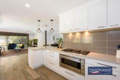 4 Damascus Dr Greenmount WA 6056 $810,000 Experience a lifestyle shift to hills living with this splendid 4 bedroom, 2 bathroom home that has undergone an extensive renovation, on a 907 sqm family friendly block. 4 bedrooms 2 bathrooms Brick & Colorbond home Modern quality fittings Formal & informal living Ducted evap cooling Dbl C/Port & w/shop area Alfresco entertaining Large below ground pool Fully fenced, 907 sqm Foothills location The property boasts a thoughtful layout with both formal and informal living spaces, highlighted by a central open plan area, leading to an expansive alfresco entertaining zone and a below-ground pool in the secure fully fenced backyard. The attractive family home is situated in a fabulous foothills location surrounded by towering palm trees, a well-manicured lawn, and a decked portico featuring an oversized timber and glass front door. The grand front entry unfolds to reveal a formal lounge with timber-look floors, creating an inviting space for entertainment or quiet retreat from the central living zones. The lounge is complemented by an impressive main suite on one side, featuring a shiplap wall, plush carpet, a fully tiled ensuite, and a spacious walk-in wardrobe—all designed with luxurious finishes. The heart of the home is a well-conceived open plan kitchen/family/meal area with quality stone benchtops, an integrated breakfast bar, hi-gloss tiled splashback, separate pantry and top-of-the-line appliances. The family room is enhanced by plush carpet and wainscoting, offering a cozy atmosphere, while a gas imitation woodburner and modern ducted evaporative cooling ensure year-round comfort. A separate junior wing houses three bedrooms, two with robes and one with a built-in desk, accompanied by a fully tiled family bathroom and a walk-through laundry with ample bench space and storage. A sliding door from the open plan living area leads to a spacious alfresco entertaining area with a timber-lined ceiling, fan, and slow combustion fire. The poolside space is generously proportioned, accommodating a large table, BBQ, and even a bar fridge cavity. The below-ground pool, adorned with paving and a reticulated green lawn, adds to the outdoor allure.The property is equipped with a large, secure storage/workshop space at one end of the outdoor entertaining area which is adjacent to the remote-access 2-car garage. Strategically located in Greenmount, this address provides easy access to good schools, shops, the airport, and arterial links, coupled with the nearby National Park, making it an ideal choice for those seeking the beauty and adventure of Perth Hills living. 
