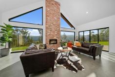 61 Bull Oak Way Grove TAS 7109 $1,400,000 Situated 30 minutes drive from Hobart's CBD at the entrance to the Huon Valley, this stunning four bedroom, two bathroom, two living room home offers a rural lifestyle within easy access of the city. Situated on 1.1 hectares (2.77 acres) of land, the 2022 built home has stunning views across the fertile valley to the dramatic western peaks of the Kunanyi/Mt Wellington range and iconic 'Sleeping Beauty'. The location and size of the block and the orientation of the house combine to maximise not only the views and sunshine throughout the day, but also the property's appeal. A white gravel driveway opens to the main entrance to the house, where a wide covered porch shelters double front doors. The architect's design is evident reflecting the stunning environment, with cathedral ceilings, hydronic heated polished concrete floors, floor-to-ceiling windows and exterior timber feature walls. The simplicity of the floor plan creates two separate bedroom wings on either side of the extensive kitchen/dining/living area. The primary bedroom has a large walk-in-robe plus luxurious ensuite with dual showers, while the other three double bedrooms have built-in-robes and access to a family bathroom with bath and shower, plus a separate toilet. The striking feature of this house is the living area with its cathedral ceiling creating a sense of space and light and having views to the mountains from every vantage point. Double sliding doors open to the patio on the northern side of the building, an ideal alfresco area, especially for evening drinks and barbecues as the sun sets over the Huon Valley. A second living room is accessed from the main living area and is a perfect TV room, play room, or quiet space for relaxation. A council approved 96m double garage and self-contained studio with bathroom has been designed to be located on the south-western side of the gravel driveway. There are 2 x 24,000L water tanks on the property, allowing you to forget about high water bills. The property is fully fenced with an electric gate and wallaby proof, to keep out the local wildlife and keep in your pets and children. The regional centre of Huonville is only 10 minutes' drive away providing a range of services from medical, to banking and other commercial facilities including a variety of shops and cafes, plus local primary and high schools. The Huon Valley is increasing in popularity as boutique industries develop throughout, including in the nearby townships of Cygnet and Franklin: an ideal location for a change of lifestyle. 