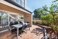  Unit 8/54 Hampden Rd Russell Lea NSW 2046 Renovated to an impressive standard throughout, this townhouse delivers style & space in a convenient location, a boutique block of eight with a northerly aspect. Bright living/dining space that flows to an oversized wrap around courtyard as well as a luxury open plan gas kitchen featuring stone benchtops & new appliances. The upper level has two bedrooms both with lofty, vaulted ceilings & built-in wardrobes. Sleek tiled bathroom with large waterfall shower. Two security undercover car spaces & lock up storeroom. Ready to move into with local eateries, bayside parks & CBD buses only 500 metres away. • Spacious combined living & dining area with air conditioner. • Light filled master bedroom with built in study desk & air conditioner. • Brand new plan kitchen with gas hotplate, wall oven & dishwasher. • Designer bathroom with classic vanity & waterfall shower. • Timber floors through out & large laundry with guest toilet. • Sunny wrap around paved courtyard & gardens, great for entertaining. • Two security undercover car spaces with lock up storeroom. 