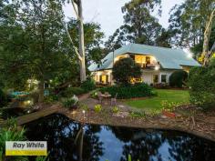  35 Barbigal Place Lesmurdie WA 6076 $1,890,000 Be Warned - There is only one - and it can only be owned by someone who will appreciate it and carry on the legacy that previous owners have inherited and contributed to over the years - this is more than an estate or a home this indeed is a LIFESTYLE. More than any other home on the market today this property truly does deserve every superlative and with the clichéd words ringing in my ears I can say without fear or favour that this property will not disappoint. If you want the best on offer in the hills today then please do not miss this opportunity to provide you and yours with the BEST. Designed by the forward mind and driven by excellence in Architecture this Peter Overman home began life deep in the thought cycle of someone who wanted to CREATE. It started with the search for the perfect location - not just Orange Valley but tucked away in an easy to miss cul de sac that runs off one of the area's finest promenades. Intersected by a stream and spreading its considerable girth over two green titles the block encompasses some of the finest in the area The process continued with the design execution and completion of one of the area's finest homes - more than any other this property is destined to become a landmark not just by location but in history. Built in time of home excellence and garden design the well thought out and planned gardens feature large water features that virtually encompass the property and give it its name. This property is resort like to the extreme and if you are wanting a place to reside that makes you feel that you are in another place, this is it, so much so that the property other than a family home would make a fantastic retreat ,Yoga college or perhaps a live in Cuisine based business, the possibilities are endless. The Residence - Resplendent in White the building stands out as a stark contrast to the landscape - surely designed that way for effect, the entrance is wide and welcoming. With character features here and there dating from its beginnings they enhance the sense of style and quality that began from day one. A staircase leads away to the master suite which is worthy of any hotel, with its space and storybook balconies overlooking the amazing gardens this area is large enough for master bedroom, study, lounge/retreat and still more. In addition to the master there is of course 3 more bedrooms almost identical to each other and all with sundrenched north facing outlooks over the pool and gardens. There is a room suitable as another bedroom or second study and the house has a generous dining room and large family room with an amazing waterfall and pond outlook, indoors and out there are places to dine and entertain like no other. There is a separate games room away from the rest of the house which is ideal for busy teens, the kitchen is galley style and of course has every convenience, the laundry is very large and would suit the most discerning of us, there is a double garage and the house has air-conditioning and a large slow combustion heater. There is an excellent bore water supply and a large workshop. This property truly is something special. 