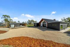  61 Bull Oak Way Grove TAS 7109 $1,400,000 Situated 30 minutes drive from Hobart's CBD at the entrance to the Huon Valley, this stunning four bedroom, two bathroom, two living room home offers a rural lifestyle within easy access of the city. Situated on 1.1 hectares (2.77 acres) of land, the 2022 built home has stunning views across the fertile valley to the dramatic western peaks of the Kunanyi/Mt Wellington range and iconic 'Sleeping Beauty'. The location and size of the block and the orientation of the house combine to maximise not only the views and sunshine throughout the day, but also the property's appeal. A white gravel driveway opens to the main entrance to the house, where a wide covered porch shelters double front doors. The architect's design is evident reflecting the stunning environment, with cathedral ceilings, hydronic heated polished concrete floors, floor-to-ceiling windows and exterior timber feature walls. The simplicity of the floor plan creates two separate bedroom wings on either side of the extensive kitchen/dining/living area. The primary bedroom has a large walk-in-robe plus luxurious ensuite with dual showers, while the other three double bedrooms have built-in-robes and access to a family bathroom with bath and shower, plus a separate toilet. The striking feature of this house is the living area with its cathedral ceiling creating a sense of space and light and having views to the mountains from every vantage point. Double sliding doors open to the patio on the northern side of the building, an ideal alfresco area, especially for evening drinks and barbecues as the sun sets over the Huon Valley. A second living room is accessed from the main living area and is a perfect TV room, play room, or quiet space for relaxation. A council approved 96m double garage and self-contained studio with bathroom has been designed to be located on the south-western side of the gravel driveway. There are 2 x 24,000L water tanks on the property, allowing you to forget about high water bills. The property is fully fenced with an electric gate and wallaby proof, to keep out the local wildlife and keep in your pets and children. The regional centre of Huonville is only 10 minutes' drive away providing a range of services from medical, to banking and other commercial facilities including a variety of shops and cafes, plus local primary and high schools. The Huon Valley is increasing in popularity as boutique industries develop throughout, including in the nearby townships of Cygnet and Franklin: an ideal location for a change of lifestyle. 
