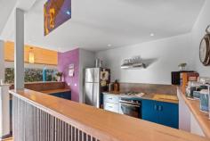  6 Acacia St Sandy Point VIC 3959 $1,100,000 Set on a low maintenance block of approx. 908m2, this unique multi level home is tucked into the treetops and just 30 metres from beach access. No roads to cross between you and the sea! Cleverly designed to connect with the coastal environment with huge areas of glass to flood the home with natural light and frame the stunning treed outlook, and multiple decks allowing the interior to spill outside. The soaring timber lined ceiling creates a wonderful feeling of space in the living room, bathed in sunlight and opening out to decks on three sides. Warm in winter with a wood heater, and cool in summer with RC/AC and the sea breeze. Well appointed kitchen is the heart of the home with a gas hob, underbench oven and servery to dining area. Two large fitted bedrooms on this level, both with adjoining decks, plus the family bathroom / laundry and separate w.c. The master suite is the crowning glory, offering complete privacy on the upper floor with expansive views and ensuite bathroom. The perfect retreat to listen to the sea. Outside, the bush block requires minimal upkeep, has parking for multiple cars with a semi-circular driveway, under home storage and water tank. Relax, recharge and connect with nature. 