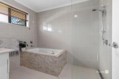  20 Allawah St Albany Creek QLD 4035 Perfectly updated to provide stylish move-in living over a flexible layout, this inviting home also boasts the tremendous space of a 905m2 block and room for all your toys! Nestled within walking distance to multiple schools, shops, dining, bus and parkland, it is ideally sized and well laid out for growing family demands. Features Include: - 905m2 - Renovated interior with flexible layout - Open-plan living and dining with air-conditioning and polished timber floors - Separate sun room offering perfect sitting or study area - Upgraded modern kitchen with superb storage, stainless appliances and stone - Huge yard with large front yard, fenced backyard and massive in-ground swimming pool with poolside cabana - Four bedrooms; three including built-in storage - Upgraded modern bathroom with floor to ceiling tiling, frameless glass shower and bath - Office and Rumpus downstairs with built-in storage and scope for dual living - Second bathroom on lower level - Internal laundry - Two separate driveways and gated side access with plenty of space for caravan and boat - Walk to multiple schools, shops, dining, parkland and bus Laid out over a multi-level floor plan, the home opens to polished timber floors and a contemporary palette combining perfectly with effortless style. Open-plan living and dining are air-conditioned with a rear sun room offering extended space for a private sitting room or even a study zone. Boasting an impressive modern upgrade with everything desired for easy catering, the central kitchen has plenty of storage with sleek white cabinetry wrapping around the zone. A glass splashback complements stainless appliances whilst stone tops the abundant bench space. Outside you can capitalise on the luxury of your massive block with exceptional fenced space for kids to play in the backyard, as well as the additional huge front yard also at hand. The in-ground swimming pool boasts tremendous sizing as well as a poolside cabana perfect for entertaining with cocktails in hand. There are four bedrooms with three including built-in storage and all centred close to an impressive family bathroom; immaculately upgraded with frameless glass shower, separate bath and floor to ceiling tiling. Offering superb flexibility for a wide range of requirements, the lower level offers three multi-purpose rooms, all of various sizes and comfortably appointed. Together with built-in storage and a separate bathroom, there is scope to utilise this space for dual-living or home based business if desired. Additional features of this impressive home include an internal laundry, garden shed, gated side access and two separate driveways with endless space to accommodate caravans, trailers and boats. Sitting in a quiet pocket, you can easily walk to a wide range of amenities including Albany Hills State School, Albany Creek State High, local shops and dining. Expansive parkland, bike and walking tracks are at your door whilst bus stops are also at hand for easy commuting. Location Information: A popular North-Brisbane suburb and highly sought-after destination for families, there are four primary schools, a renowned high school and five child care centres in the district. Brimming with wonderful green public space, parkland and nature reserves there are also impressive local amenities providing multiple shopping centres as well as a huge array of restaurants and food outlets. Direct public transport links to the nearby Prince Charles and Holy Spirit hospitals, Westfield Chermside, Brookside Shopping Centre and the CBD. 