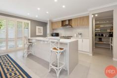  11 Dunnett Avenue North Rothbury NSW 2335 $885,000-$940,000 Are you looking for luxury, quality and size with easy-care landscaped gardens? This stunning home is move-in ready and centrally located in Huntlee Estate, one of the most sought-after estates in the Hunter Valley. Only minutes to the Hunter expressway, Huntlee Tavern, Coles, Chemist, childcare centre, dog park, a massive playground, and a short drive to the world-renowned Hunter Valley wine country, there is no better place to call home. It was built by Sekisui. and was originally a display home. Immaculately presented, this home will suit the fussiest of buyers and has everything you can dream of throughout this sizable haven. As you step inside, you are greeted by a wide hallway leading to the centre of the home with downlights, ducted air conditioning and ceiling fans, ensuring an air of luxury and sophistication. Floor-to-ceiling windows are covered with elegant drapes or plantation shutters. Multiple spacious living and entertainment areas allow guests and family to spread out and enjoy their own privacy. A purpose-built study with built-in desks gives you room to work from home. The children can have their own rumpus/activity area, set well away from the main living; there is ample space for the whole family to relax. A spacious, contemporary kitchen features an expansive Butler's pantry, stainless steel appliances, a stunning 40mm stone benchtop with waterfall edging, a large breakfast bar, and ample storage space for all your culinary needs. There is loads of room for the chef of the family to cook up a storm! Four generously sized bedrooms are well-appointed, featuring built-in robes, plush carpet, and large windows. The grand master suite stands independently and has been luxuriously designed with a well-sized, walk-in robe fully fitted with drawers and hanging, a spacious ensuite and floor-to-ceiling windows. It is situated at the rear of the home and is perfect for shift workers. Glass sliding doors seamlessly connect indoor with outdoor living; upon stepping outside, you will notice the impressive outdoor alfresco and expansive decking area fitted with ceiling fans for a breeze through summer and retractable alfresco blinds to protect from unwelcome weather. The backyard also boasts various seating areas ideal for entertaining or relaxing with total privacy. Tastefully designed, the garden offers a peaceful tranquillity, with a "Zen" feeling and easy care maintenance. There is no mowing needed. And yet, there is enough room to install a pool if you wish. The garage offers loads of space for large cars. It also has access via a glass sliding door into a 3rd bay suitable for use as an office, extra storage or workshop. All of the garage floor has epoxy coating, making it easy to keep clean if you have a spillage or oil leaks. A 10 KW solar power system with 31 panels saves you money with minimal electricity bills. This is a must-see home to appreciate the size and quality truly 