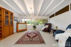  2 Bright St Ryde NSW 2112 Set on a generous 588sqm parcel of land, this much-loved family home is available for the first time in over 45 years. Set back from the road, the single-level property enjoys an elevated position in a quiet and convenient Ryde address. Offering plenty of space for growing families, the generous interiors include three bedrooms, bright living spaces, and a covered outdoor dining terrace that extends into a flowering garden with level lawn. Solidly built and well-maintained, the liveable home has plenty of potential for an exciting future makeover. Choose a stylish redesign, creative remodel, or start again with a brand-new build (STCA). Ideally located for local schools, retail and recreation. Only 200m to Ryde Park, 900m to Ryde Aquatic, 1.4km to Top Ryde Shopping Centre. • Exciting opportunity to claim a great family home in a convenient Ryde address • Queen-sized master with built-in robe, air con, and ceiling fan • Two guest bedrooms, one with built-in robe • Neat and tidy bathroom featuring shower and vanity • Two large living spaces with flow through to enclosed sunroom • Electric kitchen includes storage and plenty of benchtop space • Huge, covered outdoor dining. Large laundry and separate W.C. • Established and secure garden with level lawn, trees, and flowering plants • Off-street parking with private driveway and covered car porch 