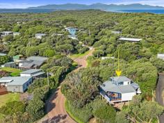  6 Acacia St Sandy Point VIC 3959 $1,100,000 Set on a low maintenance block of approx. 908m2, this unique multi level home is tucked into the treetops and just 30 metres from beach access. No roads to cross between you and the sea! Cleverly designed to connect with the coastal environment with huge areas of glass to flood the home with natural light and frame the stunning treed outlook, and multiple decks allowing the interior to spill outside. The soaring timber lined ceiling creates a wonderful feeling of space in the living room, bathed in sunlight and opening out to decks on three sides. Warm in winter with a wood heater, and cool in summer with RC/AC and the sea breeze. Well appointed kitchen is the heart of the home with a gas hob, underbench oven and servery to dining area. Two large fitted bedrooms on this level, both with adjoining decks, plus the family bathroom / laundry and separate w.c. The master suite is the crowning glory, offering complete privacy on the upper floor with expansive views and ensuite bathroom. The perfect retreat to listen to the sea. Outside, the bush block requires minimal upkeep, has parking for multiple cars with a semi-circular driveway, under home storage and water tank. Relax, recharge and connect with nature. 