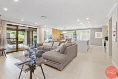  11 Dunnett Avenue North Rothbury NSW 2335 $885,000-$940,000 Are you looking for luxury, quality and size with easy-care landscaped gardens? This stunning home is move-in ready and centrally located in Huntlee Estate, one of the most sought-after estates in the Hunter Valley. Only minutes to the Hunter expressway, Huntlee Tavern, Coles, Chemist, childcare centre, dog park, a massive playground, and a short drive to the world-renowned Hunter Valley wine country, there is no better place to call home. It was built by Sekisui. and was originally a display home. Immaculately presented, this home will suit the fussiest of buyers and has everything you can dream of throughout this sizable haven. As you step inside, you are greeted by a wide hallway leading to the centre of the home with downlights, ducted air conditioning and ceiling fans, ensuring an air of luxury and sophistication. Floor-to-ceiling windows are covered with elegant drapes or plantation shutters. Multiple spacious living and entertainment areas allow guests and family to spread out and enjoy their own privacy. A purpose-built study with built-in desks gives you room to work from home. The children can have their own rumpus/activity area, set well away from the main living; there is ample space for the whole family to relax. A spacious, contemporary kitchen features an expansive Butler's pantry, stainless steel appliances, a stunning 40mm stone benchtop with waterfall edging, a large breakfast bar, and ample storage space for all your culinary needs. There is loads of room for the chef of the family to cook up a storm! Four generously sized bedrooms are well-appointed, featuring built-in robes, plush carpet, and large windows. The grand master suite stands independently and has been luxuriously designed with a well-sized, walk-in robe fully fitted with drawers and hanging, a spacious ensuite and floor-to-ceiling windows. It is situated at the rear of the home and is perfect for shift workers. Glass sliding doors seamlessly connect indoor with outdoor living; upon stepping outside, you will notice the impressive outdoor alfresco and expansive decking area fitted with ceiling fans for a breeze through summer and retractable alfresco blinds to protect from unwelcome weather. The backyard also boasts various seating areas ideal for entertaining or relaxing with total privacy. Tastefully designed, the garden offers a peaceful tranquillity, with a "Zen" feeling and easy care maintenance. There is no mowing needed. And yet, there is enough room to install a pool if you wish. The garage offers loads of space for large cars. It also has access via a glass sliding door into a 3rd bay suitable for use as an office, extra storage or workshop. All of the garage floor has epoxy coating, making it easy to keep clean if you have a spillage or oil leaks. A 10 KW solar power system with 31 panels saves you money with minimal electricity bills. This is a must-see home to appreciate the size and quality truly 