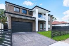  84 ALLAWAH Street Blacktown NSW 2148 New Architecturally Designed this spacious double-storey home is an entertainer's dream. sitting on a high side of the street designed with sleek contemporary aesthetics which is ultra-modern in concept and warmly inviting. * Spacious wide entry foyer via large doors * Massive light filled open plan dining & living zone. * Additional living space * Sleek & stylish kitchen features large island bench with Caesarstone tops , quality stainless steel appliances, gas cooking, dishwasher. * Generous study / home office * Huge master suite comprises of large walk-in robe and palatial ensuite with freestanding bathtub and vanity . *Modern Balcony with pleasant view. * Modern family bathroom with bathtub. * Automatic double lock up garage with internal access. * 4 indulgent bedrooms. * 3 ultra modern bathroom with stone-top vanity, bath and shower. * multi-zone ducted air-conditioning ensure this home sets a benchmark for comfort, style and conscience. * Down-lights throughout the home. * Huge, secure back yard. * outdoor Alfresco area. Close to Blacktown station. Bus stop, school and shopping Centre. 