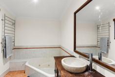  25 Kapang Drive Cable Beach WA 6726 $899,000 Tucked away in highly-desirable Sunset Park, this beautifully crafted 4 bed, 2 bath family home with two living areas, has space, style, features and flexibility all rolled into one. And the best part? It's ready to move in mid-January! Spread over an expansive 782sqm block, the home's standout features start from the front with established, reticulated tropical gardens, large double carport and rear storeroom with roller door entry. Designed with modern family living in mind, the over 194sqm of internal living space delivers spacious, modern living with flexibility to match. Light and bright, the tiled open-plan living and dining areas boast high ceilings, plenty of natural light and feature Timber French doors that open into a spacious separate living area/games room. At the heart of the home is the gorgeous open kitchen, complete with feature wood cabinetry, stainless steel chef's oven, tiled splashbacks, walk-in pantry and long breakfast bar. Other key features include big main bathroom, separate laundry, air-con, ceiling fans, modern downlights, window blinds and more. The home itself boasts 4 beautifully crafted bedrooms, all with built-in robes, air-con and ceiling fans, including the spacious Master suite complete with wood laminate flooring, walk-in robe, double-door access to a private deck and ensuite with feature stone vanity and spa. Seamlessly blending indoor/outdoor living, multiple doors open onto the expansive decked wrap-around verandah that offers year-round protection from the elements and entertaining space for any occasion. The low-maintenance reticulated gardens require minimal upkeep, while the established towering trees provide the perfect amount of peace and privacy. Set in a secure and stylish estate, surrounded by world-class resorts and just a few minutes walk from the cafes, bars and restaurants of Cable Beach, you'll be hard-pressed to find a better home and lifestyle package on the market. But, with so much to offer, you'll have to be quick to make this home your own. 