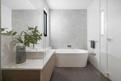 33 Tarranna Ave Plympton Park SA 5038 $797,500- $820,000 Torrens Titled with a street frontage position along the tree-lined Tarranna Avenue, this brand-new courtyard home is super sleek from start to finish. A crisp white façade with timber accents offers instant street appeal before a front porch entry opens to reveal a central hallway lined with timber floors. Enjoying front position and a lovely street outlook, a comfortable master bedroom is complete with a walk-through robe and beautiful ensuite bathroom with floating vanity and full-height tiling. A further two bedrooms are serviced by a spacious main bathroom with deep freestanding bath, shower and large vanity. Open, airy and flooded with natural light, a north-facing kitchen, dining and living space is warm and welcoming, arming home cooks with a large gas cooktop, plenty of storage space and an island with dishwasher, breakfast bar and double undermount sink. Sliding doors open onto a private, easy-care courtyard with lawn strip and side access. Delight in the details: - Ducted reverse cycle air conditioning - Built-in robes to bedrooms 2 & 3 - Separate laundry with linen storage - Secure single garage with internal access + extra off-street parking Walk to Cowra Crescent Reserve, the bus, takeaway options and local shops, while the train, schools, Edwardstown Oval and Castle Plaza and Westfield Marion Shopping Centres are within easy reach. City commutes are simple, and the sparkling shores of Glenelg are within 5kms. 