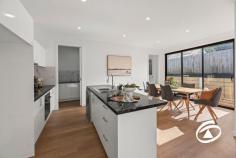 Unit 2/82 Railway Ave Garfield VIC 3814 $590,000 - $649,000 This newly constructed home is conveniently situated just minutes away from Garfield's amenities and directly opposite the V-line train station, making it ideal for commuters. It is also located next to Garfield Primary School. The well-designed floor plan features four spacious bedrooms and three bathrooms. Two of the bedrooms are master bedrooms with walk-in wardrobes and ensuites that showcase floor-to-ceiling tiles. Bedrooms three and four have built-in robes and share a central bathroom. Each bedroom is equipped with its own split system air conditioner, ensuring year-round comfort. The open-plan kitchen boasts top-of-the-line BOSCH appliances, including an electric oven, electric cooktop, range hood, dishwasher, stainless steel sink, and flick mixer taps. It seamlessly connects to a generous family living area and designated dining area that opens onto a soon-to-be-installed timber decking - an excellent space for entertaining or relaxing. Significant features of this beautiful home include stone bench tops throughout the house, a spacious butler for convenient storage solutions, a solar-boosted electric hot water system for energy efficiency, and wet areas adorned with floor-to-ceiling tiles for an appearance. The double garage under the roof line offers remote control with internal entry into the home, while an additional single lock-up garage/workshop provides secure off-street parking options. The property's low-maintenance landscaping adds to its appeal. Inspection is a must! 