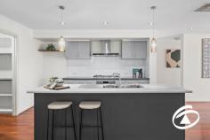  57 Filmer Cres Narre Warren South VIC 3805 $780,000 - $850,000 Welcome to your dream home in the heart of Narre Warren South! This spacious and loved family home is everything you've been searching for. As you step inside, you'll be greeted by gorgeous hardwood floors that flow throughout the house, creating a warm and inviting atmosphere. The natural light room complements the modern palette and adds to the overall charm. The master bedroom is a true retreat with a walk-in wardrobe and a modern ensuite, providing you with your private oasis. The remaining two bedrooms feature built-in wardrobes and share a central family bathroom with a bath and separate toilet. Need an office or an extra bedroom? We've got you covered! This home offers a versatile space at the front that can be used as an office or converted into a fourth bedroom. An open plan living, dining, and kitchen are central to the clever floor plan. The kitchen boasts stone benches, and stainless-steel appliances including a dishwasher, and even has a walk-in pantry. Prepare meals while still being part of all the action! Entertaining friends will be effortless in this home's second living space/rump room complete with its very own built-in bar. Bifold doors open up to the alfresco area and low-maintenance backyard - no mowing required! Additional features of this remarkable property include plantation shutters, ducted heating, evaporative cooling for year-round comfort, great storage options throughout, and a garage with internal access for added convenience. Location couldn't get any better! Enjoy easy access to Casey Central & Amberly Park shopping centers for all your retail needs. Explore nearby parks and walking tracks or choose from multiple schools such as Narre Warren South P-12 School, Waverley Christian College & Strathaird School. 
