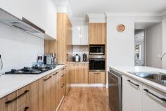  8A Talbot Grove Marryatville SA 5068 $1,100,000-$1,200,000 Boasting perfect placement in the heart of the leafy east, a bespoke design by D'Andrea Architects, and construction by award-winning Zee Homes, 8a Talbot Grove is the embodiment of elevated living. High on impact while low on maintenance, it's an enviable next step, no matter your plan. Rich red brick and sleek render front a floorplan defined by extensive open-plan living area, panoramic windows and northern orientation ensuring no shortage of natural light. Sleek oak-toned floors sweeps across a gourmet kitchen, stone-topped island bench connecting all zones for seamless flow, while a full suite of stainless-steel appliances, gas cooktop, and corner pantry unite to create a worthy workspace for chefs of all commitment levels. Sliding doors integrate indoors and out, gliding to pitched roof pergola, your alfresco hub for everything from quiet moments of contemplation to extended family brunch, delivering the ultimate easy-care outdoor area for zero downtime scarified to excessive garden care. Bookended by walk-in robe and luxe ensuite, a generous main bedroom provides an exceptional retreat to start and end the day. Tucked privately in their own wing, two additional spacious bedrooms are each complete with built-in robes, fully serviced by a family bathroom with contrast tiling, corner shower and ultra-wide vanity ready to host rush hour with ease. In a simply unmatchable location, it's a short walk to Tusmore and Hazelwood Parks for summers spent poolside or perfecting your backhand, while Burnside Village, Kensington Road and Norwood Parade place endless retail and vibrant nightlife close by. Only a 10-minute drive to the CBD, with zoning for Marryatville Primary Schools and a short walk to Marryatville High School, plus your pick of Adelaide's finest private schools in close radius for a streamlined commute and school run. Everything that makes the eastern suburbs so coveted wrapped up in a truly impressive package - you'll never look back. More to love: - Private rear placement in small group of four - Solar panel system - Secure double garage with interior and rear pedestrian access - Separate laundry with external access - Ducted, zoned reverse cycle air conditioning throughout - Security system - LED downlighting - Rainwater tank 