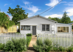  17 Main St Clunes NSW 2480 $949,000 Clunes, a character filled village with a strong sense of community, is just 10 minutes drive to Bangalow and twenty minutes to Byron Bay and recently has become a highly desirable rural location for Byron Hinterland buyers offering shops, cafes, a school, service station and numerous small businesses. Perched on a ridgeline with stunning eastern rural views this village is on the brink of dynamic growth with many seeking the peace and people of the hinterland but within easy reach to the buzz of the beachside. This charming character filled cottage has it all - potential plus located in the heart of the village with sunny easterly views, an enormous 1005 sqm block of land and a Village zoning. Currently operating as a studio, workshop and showroom it is the perfect solution for an artisan to work from home immersing themselves in a lifestyle home and country workspace at the same time. It may equally well be converted back to a family residence, renovate or extend, or may suit a tradesperson, professional suites, educational space, wellbeing centre - the list is endless (STCA). As a house it offers 2 bedrooms, lounge/dining area, huge rumpus room, office and a large outdoor area overlooking a back garden of grand proportion. The floorplan is quite flexible. Constructed in timber weatherboards with a colourbond roof the home is of solid construction with timber floorboards and large sun-drenched windows giving the interior an airy, well lit and welcoming feel. There is a pretty picket fence dressing the front of the home and a pebble driveway leading to the private, fenced back yard. Three phase power has been installed and plans prepared DA ready for a 100sqm barn to be constructed. Town water is connected. 