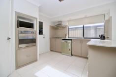  14 Colreavy Ramble Baldivis WA 6171 $675,000 Discover a great opportunity to step into the housing market with this charming 4-bedroom, 2-bathroom home nestled in Baldivis Central. Built by the Ventura Home Group in 2010, this property exudes a welcoming ambiance with its tasteful neutral decor. Highlights include a separate enclosed theatre room, a spacious master suite, and an open-plan design that seamlessly integrates the family, dining, and kitchen areas, where stone benchtops, a 5-burner gas hotplate, and stainless steel appliances await. Additional comforts include ducted evaporative air conditioning, a convenient shoppers' entry to the kitchen, and a newly landscaped low-maintenance garden. Embrace the lifestyle you've been dreaming of in this immaculate Baldivis residence, perfect for both relaxation and entertaining. • Ducted evaporative air conditioning throughout • Separate living areas including a theatre room and open plan living area • Large kitchen with double fridge recess, stainless steel appliances, dishwasher, stone bench tops, and ample cupboard space • Huge master suite with his/hers walk-in robes and a deluxe ensuite with bath, twin sink vanity, shower, and separate WC • Bedrooms 2 and 3 generously double-size, while the king-size 4th bedroom offers a walk-in robe • Walk-in linen in the laundry provides extra storage space • Access to the rear through the garage • Low maintenance gardens and freshly laid lawn front and back • Enjoy entertaining under the alfresco, which is also suitable for outdoor dining • 512sqm block of land with 169sqm of internal living space 