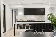  2F Egerton Ave Rostrevor SA 5073 Architecturally designed by the award winning Regent Homes, each fixture and fitting has been meticulously selected and is evident upon entering this stunning home constructed in 2023. Boasting a family sized floor-plan and sitting on an impressively sized block of 434sqm; there is plenty of room across both levels allowing privacy, space and flexibility for growing families. As you approach the front door via the stunning cantilever concrete steps and enter, you will instantly be in awe of the modern, crisp white and stone aesthetic complimented by stunning polished concrete floors. The four bedrooms are carpeted with built in wardrobes, and oversized windows eliminating the use for all day lighting. Enjoy the spacious main bedroom located on the ground floor showcasing a large walk-in robe and luxurious ensuite bathroom complete with terrazzo tiles imported from Italy, a dual-shower head, frameless shower screen and dual vanity. Transcend upstairs via the oak timber staircase into a large second living space fitted with easy clean engineered timber floors, perfect for a children’s retreat or extra guest entertaining space. The three bedrooms on this level share a gorgeous main bathroom complete with freestanding bathtub and a stunning tiling and fixture combination we are sure you'll love. The spacious downstairs living area incorporates a stunning oversized curved stone bench with plenty of room to prepare meals and entertain your guests. SMEG appliances set the bar high with style and functionality flowing through into the concealed butlers pantry which offers a built in bar, an abundance of storage along with a hidden sink and dishwasher. Avid entertainers will appreciate the undercover alfresco with built in gas line and outdoor fan. The spacious rear yard features a sparkling, electric heated swimming pool and large lawn to unwind with family and friends. Here's your opportunity to not only own an exceptionally crafted, custom-built home, but a chance to be part of a great community within this well loved location. Walk to Morialta Conservation Park on weekends, find your favourite coffee shop nearby and enjoy a selection of top-tier schooling options at your fingertips with Rostrevor College, Saint Ignatius College, Stradbroke Primary School and the brand new Morialta Secondary College just to name a few. Less than 5-minutes drive discover the well equipped Newton Shopping Centre or Firle Plaza, as well as the vibrant Parade in Norwood for shopping, café, specialty stores and weekend entertainment options. Added benefits include: *Family-sized electric heated swimming pool *Double car garaging *High fencing for privacy *Ducted and zoned, reverse cycle heating and cooling *2.7m ceiling heights *Semi commercial windows frames *Downstairs powder room with third toilet *Quality flooring throughout including polished concrete and imported terrazzo tiles *New sheer curtains *Separate downstairs laundry *Built in roof provisions for solar 