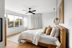  2A The Spur Frankston South VIC 3199 $1,250,000 - $1,375,000 Presenting an alluring lifestyle of exclusivity and coastal elegance, this renovated beachside home effortlessly blends timeless charm with contemporary sophistication. Nestled amidst a picturesque back-drop of lush greenery, a lofty elevation and modern facade forms a bold street presence to this five-bedroom FHSZ home. Delighted by a north-facing light, the dual-storey design delivers families a firm entertaining footprint where everyday living holds focus across a first-floor domain. Alluring with white-washed timber beams and a clean neutral palette, the light-filled level anchors accommodation with an open plan lounge and dining space, and kitchen complete with servery window, stone benchtops and premium-grade appliances. Making use of its elevation sees a private treetop alfresco extend entertaining outwards, while an intimate space for the children remains to the rear with direct Frankston Jamboree Park access. A dreamy master bedroom provides luxury for parents, with a dressing room and stylish ensuite, custom sheers and north-facing orientation. Servicing both family and guests, a main bathroom with stone-topped vanity sits central to three additional bedrooms across the top floor. The glimmer of a gas fireplace warms the downstairs level, where a generous lounge with wet bar, updated main bathroom and fifth bedroom with private alfresco access inspires a guest/teenager retreat, or the potential for short-stay accommodation (SCTA). With reverse-cycle ducted heating and cooling, solid timber floors, custom window furnishings, alarm system, a single garage and architecturally-designed gardens by Colin Hyett Design, this contemporary home sits only moments from Frankston Foreshore and Boat Ramp, Frankston High and Overport Primary School, and Bayside Shopping Centre. 