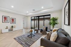  1 Dingera Ave North Plympton SA 5037 $880,000-$960,000 With a striking gabled north-facing facade, this brand new Torrens Titled home is built with class and convenience at its forefront. Herringbone floors line the entry hallway, where an accessible plushly carpeted master bedroom at the front of the home reaps the rewards of its northerly-aspect with abundant natural light, as well as the comforts of a walk-through robe and luxurious ensuite bathroom with full-height large format tiling and shower with wall niche and rainfall showerhead. An additional two bedrooms each enjoy mirrored robes and are serviced by an equally impressive central main bathroom with deluxe fittings, inset bath and roomy shower. Overlooking a spacious living and dining space with bulkhead, the sleekest of galley-style kitchens offers a gas cooktop, subway-tiled splashback, double sink, dishwasher and breakfast bar with waterfall benchtop to kitchen creatives, as well as plenty of overhead storage space and decorative pendant lighting. Sliding doors reveal a secure, minimal-maintenance alfresco with open timber pergola and lawn strip. The finer points: - Ducted reverse cycle air conditioning - Spacious double garage with laundry facilities + side & internal access - Off-street driveway parking - Linen storage - Landscaped front garden Let's talk location. Central to city and sea, the neighbouring Weigall Oval Reserve and Westside Bikeway will provide endless respite for restless legs within walking distance; the tram, bus, local shops and cafes, the Highway Hotel and schooling options for all ages all within a kilometre radius. It's contemporary, clean-lined convenience at its finest. Brand new looks good on you. 