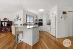  17 Herden Road Tamworth NSW 2340 $969,000 Pure exquisiteness on a sprawling 5,460sqm block in the heart of Kingswood you will find 17 Herden Road. This magnificent slice of paradise features beautiful, manicured gardens as far as the eye can see along with established trees and bushes. As you make your way up the stairs and enter this stunning home you are greeted with lovely stained-glass features incorporated into the front door, off to the left you will find an enormous sized bedroom with large glass windows that allow the natural light to seep through and fill this wonderful space. Making your way through you will come across the master bedroom that boasts a large walk in robe along with a private ensuite attached, with glass sliding doors that allow you personal access out to the back undercover patio area this room provides ultimate luxury and comfort for parents to relax. The remaining two bedrooms both offer built in robes, ceiling fans and large windows for stunning outlooks. Throughout the home you will notice plenty of storage space and charming stained-glass windows featured in the doors to the loungeroom, fitted out with reverse ducted aircon as well as gas points for heating. Make your way outside to the tiled undercover alfresco area with an installed vergola making this the perfect place to spend your evenings or for when you are entertaining friends and family, the picturesque outlook of magical gardens instils the calm and relaxing feeling this home offers. At the front of the property you will find a double lock up garage with a double carport extension attached. This shed is fully insulated with a shower, toilet and basin installed as well as an additional three bay lock up garage with an additional three bay carport extended off the front. This offers you an ample amount of car and storage space or the opportunity to create a great workshop or mancave, all of this is easy accessible with a asphalt driveway. 17 Herden Road also has 14 solar panels installed along with a solar hot water system that feeds the house. 