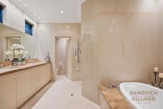  2A Strome Rd Applecross WA 6153 Enter through the 250 year old French antique doors and begin the luxurious lifestyle on offer at this elegant home, located in a prime position on one of the most desired streets in Applecross. Standing on a 588sqm green title lot, this European inspired, classic and timeless Brian Burke home was architecturally designed with comfort, convenience and security in mind. The home commands a strong street front presence and contains multiple entertaining areas, a 1500 bottle temperature controlled wine cellar, an impressive master suite, quality finishings and landscaped picturesque gardens. The main first floor entertainment area boasts impressive features, including a built-in fireplace and surround sound. The formal dining area features under floor heating and folding concertina doors that open up to the north facing balcony, with an overview of the back yard and glimpses of the river. The heart of the home features a gourmet kitchen, a culinary masterpiece meticulously crafted for both style and functionality. Featuring top of the range Miele appliances, stone island benchtops and breakfast bar, wall mounted ovens, an additional built in bar fridge, a large walk in pantry and ample quality cabinetry. Whether hosting family gatherings or lavish soirees, this kitchen is sure to impress even the most discerning guests. Retreat to the master suite, where luxury and comfort converge to create a private sanctuary unlike any other. This expansive bedroom boasts a private balcony with an automatic sun sensor blind and huge walk in wardrobe. The ensuite bathroom features a dual sink stone marble vanity, floor to ceiling tiling, a bath tub and heated floor and towel rails. The other two additional bathrooms and two powder rooms are finished to a similar high standard. French doors open up to a self contained retreat, complete with a private living room, kitchenette, large bedroom, walk in robe and ensuite. Perfect for guests, teenagers or family who come to stay. There are also two further bedrooms for your enjoyment. Venture outside, and you’ll discover a breathtaking oasis, completed with meticulously landscaped gardens, an undercover alfresco entertainment area, swimming pool with a decorative water feature. The pool and garden have built in lights, creating a tranquil spectacle to enjoy after sunset. The property has a front automatic security gate, double lockup garage and security sensors throughout. 2A Strome Road, Applecross has the benefit of residing in one of the most desired locations in Perth. Stroll to South of Perth Yacht Club, Applecross Tennis Club, Applecross Village on Ardross Street, many cafes, shops, bars and park plus nearby to Applecross Primary School and a short commute to Perth CBD and excellent high schools. 