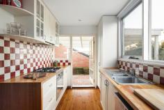  37 Gweno Avenue Frankston VIC 3199 $910,000 - $1,000,000 Crafted with creativity and a playful charm, this impeccably presented weatherboard home carries an ambience of family fun and warmth across its unique multi-level layout. Picture-perfect with its high picket fence, front verandah and garden entryway, a modern beachside lifestyle awaits a short walk from Frankston's beach and vibrant city centre. A faultless union of period charm and modern comfort amplifies a traditional layout, introduced by solid hardwood floors and swathes of natural light. Immediately cosy with the crackle of an open fireplace, the first of two living zones inspires creativity with a wrap-around bookshelf and a beautiful bay window, before three bedrooms (BIRs) and a central family bathroom complete with combined shower and tub, are introduced along a central hallway. North-facing light is captured to the rear with direct deck access, merging indoor-outdoor entertaining across a split-level lounge and dining zone, galley-style kitchen with modern Westinghouse cooking appliances, and covered paved courtyard. Wrapped within garden that demand minimal maintenance, this unique family home within the FHSZ features a loft-style fourth bedroom or study with views across Frankston to the Dandenongs, split-system heating/cooling (social domain only), secure off-street parking, garden shed, and approved plans for a second storey addition. 