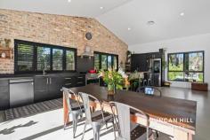  18 Badgery St Willow Vale NSW 2575 This is a home you will be thrilled to return to again and again. The design of this residence leaves nothing to chance, with unrivalled style and functionality. The large open-plan kitchen, living, and dining room boasts 4-meter pitched ceilings, an exposed recycled brick feature wall, polished concrete floors, and a slow-combustion wood fire, making it the heart of your home! Step outside onto the expansive outdoor entertaining deck. This spacious retreat beckons with panoramic views of meticulously landscaped gardens adorned with a diverse array of native plantings and the lush greenery of a meticulously tended lawn. Whether relaxing with a morning coffee or entertaining under the open sky, this inviting outdoor space seamlessly connects you to the tranquility and splendour of your surroundings. If you've been yearning for serenity, we cordially invite you to explore this remarkable property. Features include; Kemlan freestanding wood heater  Double Glazed windows in living area Roller blinds Plantation shutters  Ducted reverse-cycle air-conditioning 6.6kW solar panels Sleek kitchen with polished concrete bench tops  ILVE 90cm freestanding electric oven and gas cooktop Matte Black LG QuadWash dishwasher with TrueSteam technology Open plan kitchen/dining that connects seamlessly via bi-fold doors to the deck and recycled brick patio  Master suite with ensuite and triple robe Double robes in all bedrooms Main bathroom with floor to ceiling wall tiles, frameless shower screen and freestanding bath Irrigated lawn Established, landscaped gardens featuring vast variety of native plantings Large garage/studio 