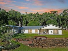  105 Barrow Hill Rd Habana QLD 4740 Location is perfect for lovers of quiet country lifestyle. Imagine the serenity on your very rural retreat of approx. 2.49 acres. Enjoy the sounds of nature - birds chirping and the gentle breezes rustling the leaves, the morning song of the cows and maybe the winnie of the close by horses. Paradise found and approx. an easy 23-minute drive to Mackay CBD. Relish the conveniences of the city while savouring your privacy and maybe your sanity. So what exactly is on offer here? A vast modern low-set home with absolutely everything you would expect in an executive residence. The kitchen forms the 'hub' of this home. Quality custom design, a huge island with feature pendants overhead, stone benches, top quality appliances and sizeable gas cook-top. Family and guests alike will all happily gather here for delicious nibblies and drinks! The seamless transition from inside living to the expansive outdoor entertaining area is priceless. Friday night football or family catch ups will be perfect as this home sprawls for all to meander inside or out. With a peaceful and private view from every window. Who needs curtains when only the trees and cows can see you…. The fresh air is rejuvenating! In the cooler months, toast marshmallows and sip on hot chocolate! Sit around the fire-pit gazing at the flickering red and orange flames. Life just doesn't get better than this! Sleeping zones are fantastic. Naturally the master suite has its own private ensuite, perfect at the end of the day and 'down-time'. Three additional bedrooms have their own family bathroom to cater for the kids or guests. But there is so much more!!! Check out these amazing extras… • A huge 12m x 10m shed with high clearance carport to front & side. • One shed has been converted into a 'Studio/Granny flat'/games room and has all amenities: kitchen, air-conditioning, laundry, toilet and bio-cycle septic. A terrific addition if you have teenagers or extended family. • Bore & tank water x 2 consisting of 40,000 L • Septic system to main residence and 'Studio /Granny flat' • There is a school bus service pickup from the main gate, servicing most inner city Primary and High Schools. This neighbourhood is for the astute buyer and is sure to impress and exceed your expectations. 