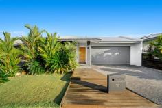  30 Rivergrass Circuit Zuccoli NT 0832 $595,000 Discover your new oasis at this meticulously maintained property, boasting a fresh coat of paint within the past year. Situated in a serene locale, this immaculate home offers unparalleled tranquillity and breathtaking views of natural bushland, especially at sunset from the poolside. Crafted by Territory Homes, this residence greets you with a captivating street presence. Step onto the wooden decking entry and admire the established tropical gardens. A driveway leads to a double remote garage, ensuring both convenience and style. The heart of the home is the stylish kitchen, showcasing white gloss cabinetry, a striking black stone waterfall island bench, and Fisher and Paykel appliances including a double drawer dishwasher and a large Euromaid gas stove and oven. A modern flair is introduced by the sleek subway tile backsplash, complemented by stylish hanging pendants in black and copper glass. The expansive primary bedroom, positioned towards the back of the house, offers views of the shimmering inground infinity style pool and serene natural bushland. It features a walk-in robe with ample storage and an ensuite with seamless glass shower and a black speckled stone vanity. Bedrooms two and three are equipped with split system air conditioning, mirrored built-in robes, while bedroom four offers similar amenities and overlooks the front garden. Entertain effortlessly in the large open-plan living and dining area, featuring two air conditions with ample cooling to get you through the Territory wet seasons. Sliding doors open onto a covered patio featuring a built-in BBQ, ideal for outdoor dining with a view of the pool. The backyard, enclosed by a full fence with panelling on each side and landscaped beautifully offers privacy and a tranquil getaway. Additional highlights include a main bathroom with floor-to-ceiling charcoal and white tiles, a separate toilet, and a laundry alcove with charcoal tiles and wooden shelf. The property is complemented by a solar-powered system with solar hot water, contributing to energy efficiency as well has been fully secured with security screens and a security system installed. Conveniently located near local parklands including recently established dog park, Zuccoli Plaza, and schools, this home offers not only exceptional living spaces but also an ideal lifestyle for families. Don't miss your chance to own this stunning property where every detail has been thoughtfully considered. 