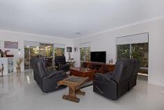  19 Sharperton Meander Dudley Park WA 6210 $689,000 Set in a peaceful area with a reserve opposite, you can simply sit, enjoy, and even watch the wildlife. Walk through the vibrant double-door entrance and be met by bright and modern decor. To the left of the entry is the spacious master bedroom with a separate ensuite, all set in neutral tones, featuring a soothing shower, vanity basin, and toilet. Continuing down the entryway, you will find the separate theatre, ready for family movie nights-get comfortable and break out the popcorn! Let your feet follow you through the home over the cool white tiling into the freshly renovated kitchen, equipped with not one, but two ovens, stone benchtops, ample storage, a dishwasher, and feature lighting. From the kitchen, walk into the open-plan living and dining area and then out onto the composite decked outdoor patio area. This space has been extended and is definitely one you can make your own to revel in relaxation, featuring a pull-down screen for sun and wind protection. Look out from the entertaining area to your own lush gardens with a tropical oasis vibe, or walk along to the left and find a private grassed area, providing the extra space you need for guests, kids running around, and more. This home also includes a study/bedroom, spacious minor bedrooms with built-in robes, a main bathroom with a bath, and a well-equipped laundry. Additionally, there is concrete parking to the left of the home, perfect for a caravan or boat, with the Mandurah Cove close by for those who love a summer day out on the water! 